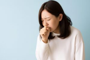 インフルエンザで苦しむ女性